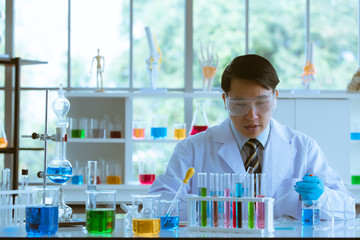 Male scientist collecting experimental samples.