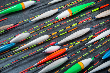 different in length , color and appearance fishing floats on the table © OlegDoroshin