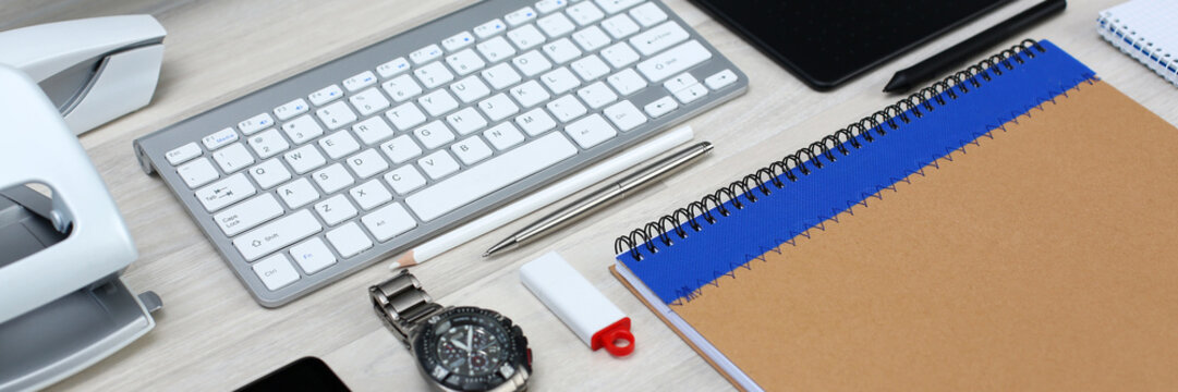 Organized designer workplace at office desk closeup