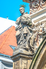 Decorative facade sculptures at Jesuit church of St. Ignatius of Loyola at Charles Square in Prague, Czech Republic