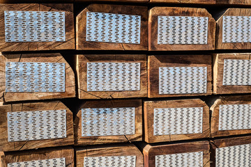 stacked of new wooden railway sleepers