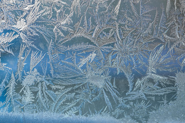 Beautiful natural pattern, frost on glass window, winter background for Christmas, New year
