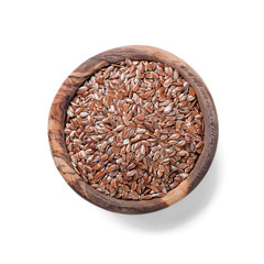 Flax seeds in a wooden bowl on white background .