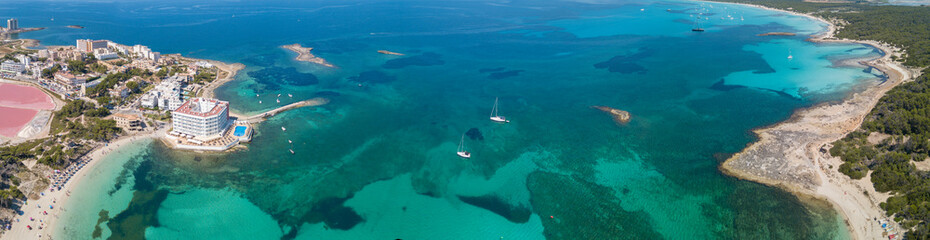 Colonia Sant Jordi, Spain. Amazing drone aerial landscape of the charming beaches Estanys and Es Trencs. Turquoise caribbean sea