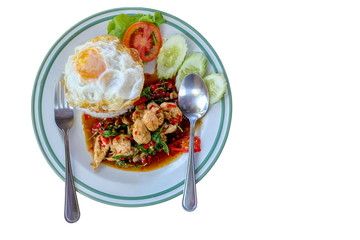 Stirred fried sea bass or white snapper with basil topped on rice on white dish