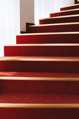 Photo of a beautiful red brown stairs in handsomea house or  museum