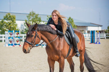 Woman in a rancho with a horse. Hobby time  
