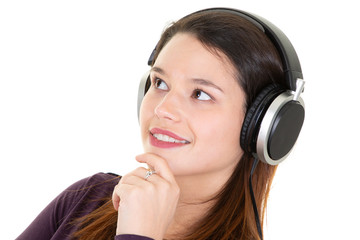 Portrait of happy young woman music lover listening song in headphones
