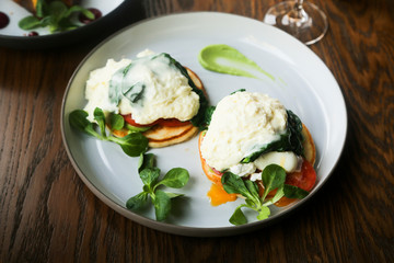 Pancakes with poached egg, cheese and spinach
