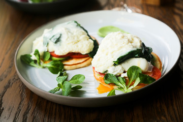 Pancakes with poached egg, cheese and spinach