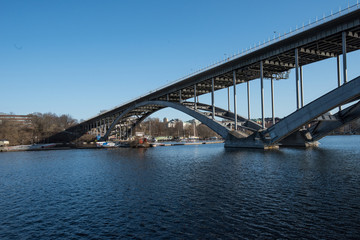 Fototapeta na wymiar Water view over the Riddarfjärden bay and bridge in Stockholm a sunny spring day,