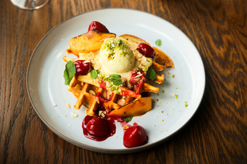 Belgian waffles with ice cream and strawberry