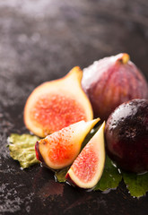 Fresh figs on black background close up