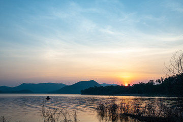 Sun rise in the morning with  dam and mountain.