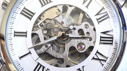 Old vintage analog clock mechanism watch time going fast, closeup detail timelapse time running fast