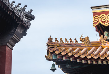 Fototapeta na wymiar Close up on a roof elements in Yonghe Temple, commonly called Lama Temple in Beijing, capital city of China