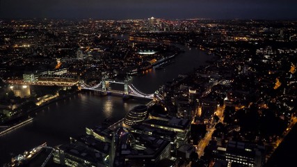 Fototapeta premium Aerial top view wide angle night panorama of London City and Tower Bridge
