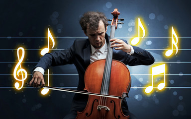 Fototapeta premium Young handsome cellist playing with music sheet background