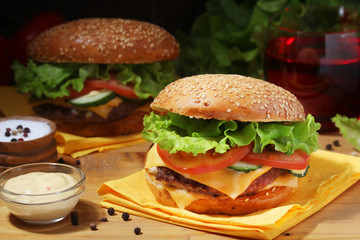Two fresh hamburgers with vegetables