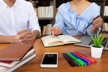 Group of young people learning studying lesson in library during helping teaching friend education prepare for exam, youth campus friendship teenager teens concept