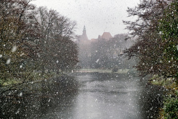 River Weser in the center of Bremen in snowy weather, Germany. March 2019