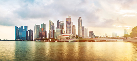 Fototapeta premium Singapore business district skyline during sunset. Group of skyscrapers at Marina Bay, Singapore.