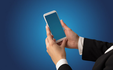 Mockup for female hand using frameless smartphone with dark background
