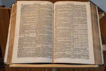 Bible is a open book. Stands open in a Swiss reformation Church on day of Konfirmation in a Swiss church.