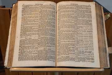 Obraz premium Bible is a open book. Stands open in a Swiss reformation Church on day of Konfirmation in a Swiss church.