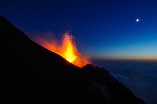 One of the most active volcanoes in Europe that sprays lava in the night on the island of Stromboli in Italy