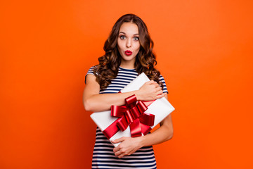 Close up photo beautiful she her lady arms big large giftbox my precious wondered what inside my mine red lips pomade wear casual striped white blue t-shirt clothes isolated orange bright background