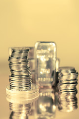 Gold bars and stack of gold coins. Background for finance banking concept. Trade in precious metals.