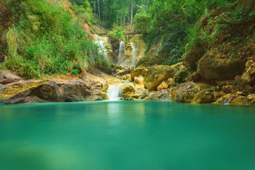 blue waterfall with a cool and fresh natural background. This waterfall is called 