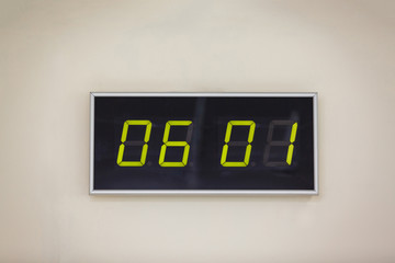 Black digital clock on a white background showing time 06.01 minutes