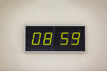 Black digital clock on a white background showing time 08.59 minutes