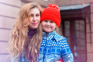 Mom with child walking outdoor, warm weather. Lifestyle portrait parents and kids in happiness , moments of life 
