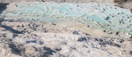 The pools of Pamukkale in Turkey. Pamukkale contains hot springs, travertines and terraces of carbonate minerals. UNESCO World Heritage Site