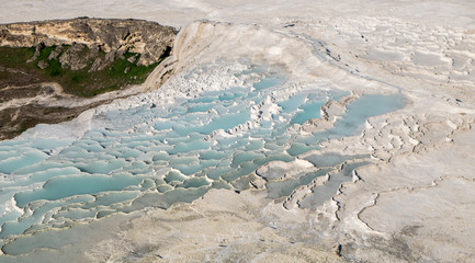 The pools of Pamukkale in Turkey. Pamukkale contains hot springs, travertines and terraces of carbonate minerals. UNESCO World Heritage Site