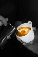 barista make coffee latte art.spot color photo