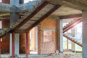 Obraz premium House under construction with red bricks.