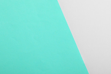 Turquoise and grey paper sheets as colorful background, top view