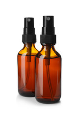 Bottles of essential oil isolated on white