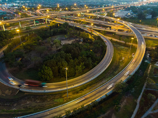 Curve of expressway at night traffic with vehicle transport