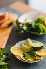 Citrus and lemonade on the table in summer