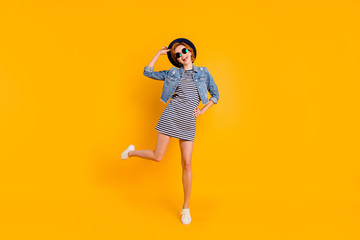 Full length body size view portrait of nice charming attractive cheerful optimistic carefree careless girl flying on air free spare time lifestyle isolated over bright vivid shine yellow background