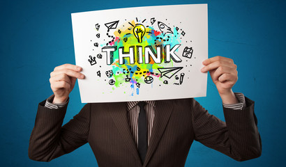 Young person holding paper with design thinking concept 
