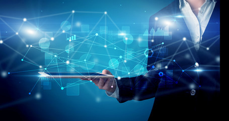 Elegant hand holding tablet with virtual database and network concept

