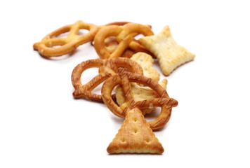 Salty cracker pretzel party mix isolated on white background
