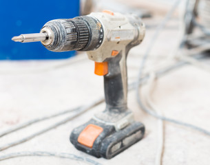 dusty screwdriver on the cement floor