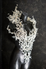 Manikin, Piece made with 3d printer, is composed of white flowers that form a corset, handmade, fantasy design Baroque style